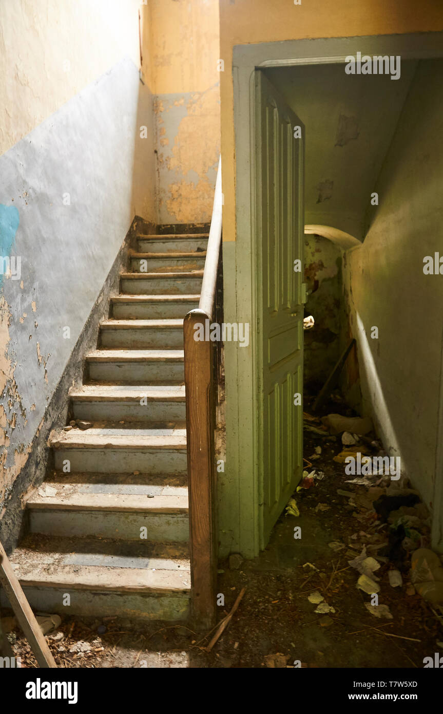 Interior stairs in ruined facilities at the abandoned Canfranc International railway station (Canfranc, Pyrenees, Huesca, Aragon, Spain) Stock Photo