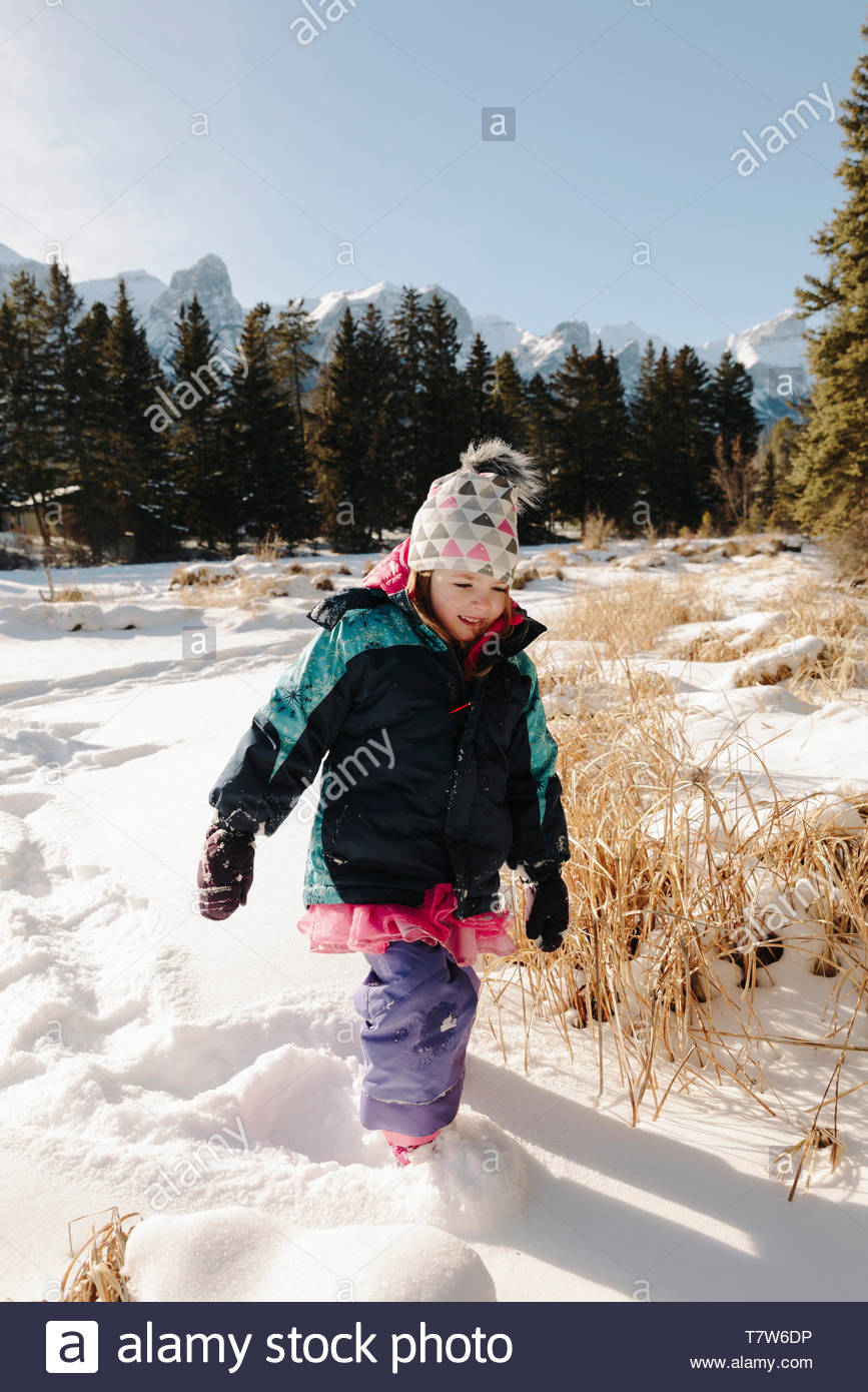 Girl Walking In Deep Snow Stock Photo Alamy