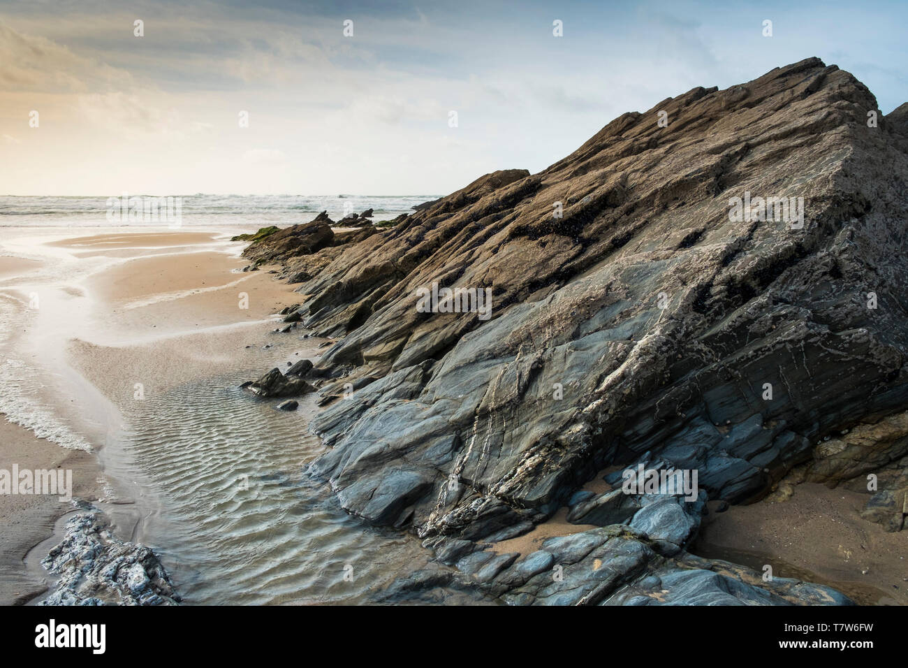 Rocks exposed at low tide on Fistral Beach in Newquay in Cornwall Stock ...