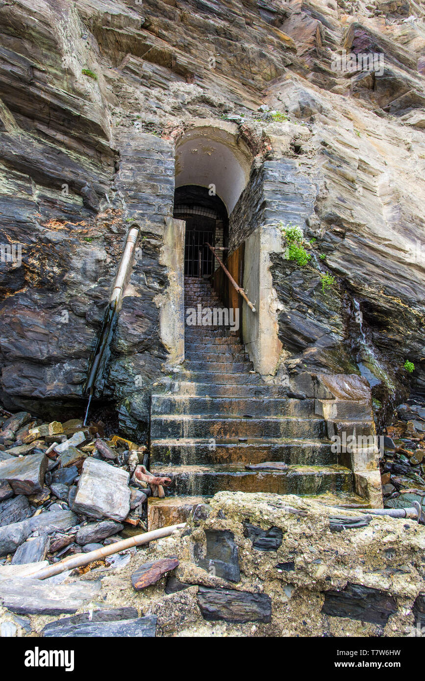 The historic disused entrance to the tunnel leading to a lift shaft from Great Western Beach to the Hotel Victoria in Newquay in Cornwall. Stock Photo