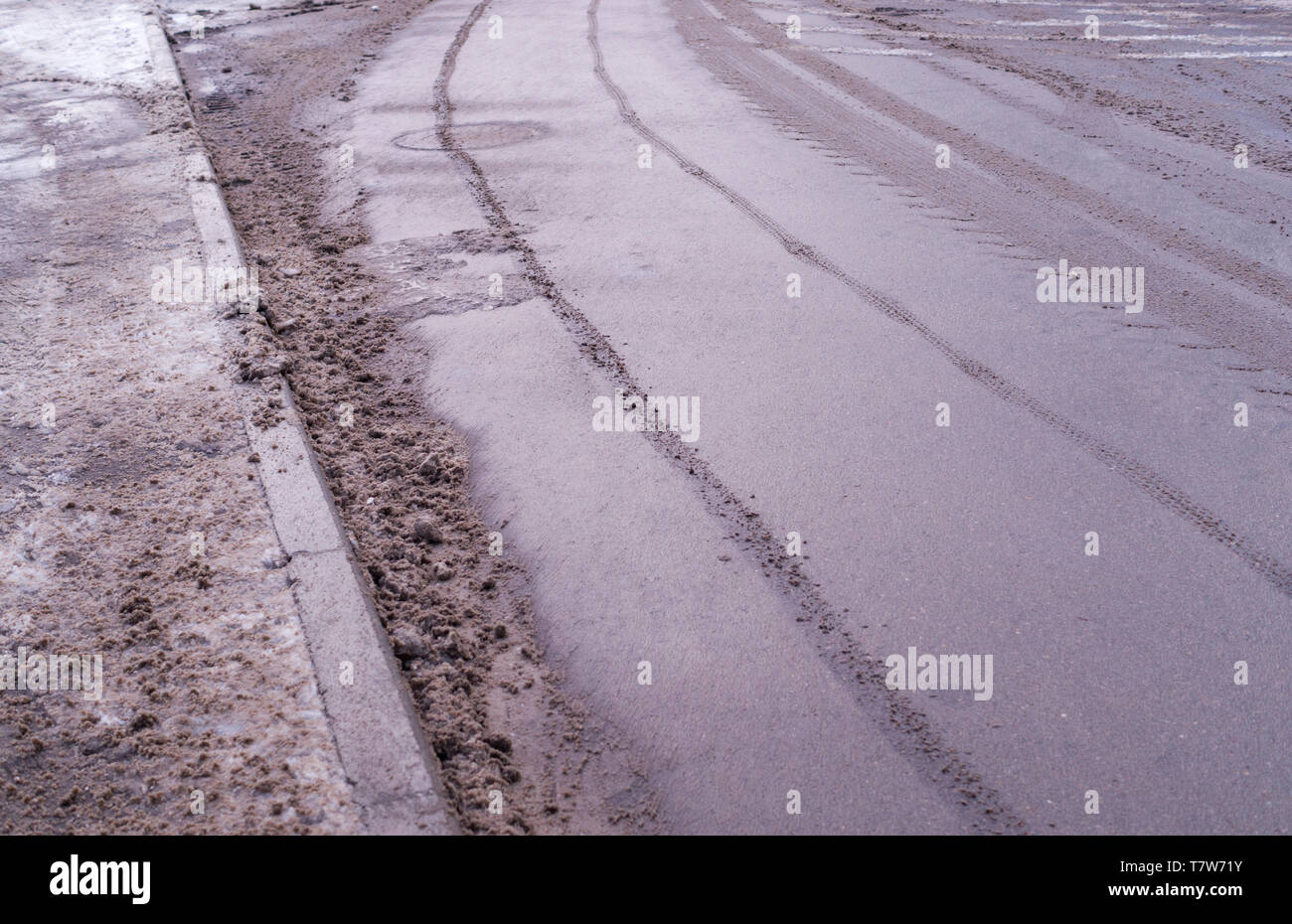 Snow Polution polluted snow on the road with car traces. background, seasonal Stock ...