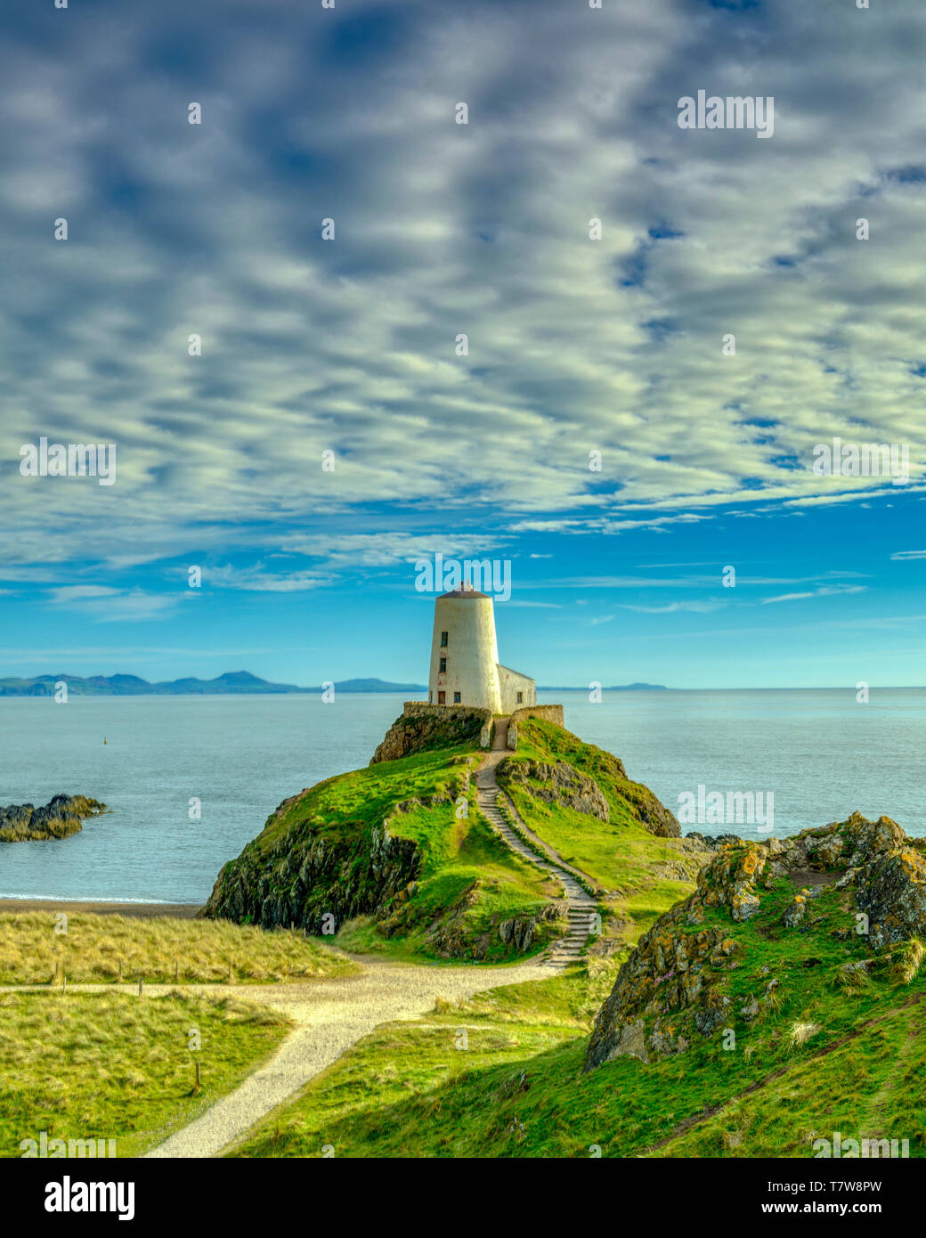 Llanddwyn, Wales - May 1, 2019: Twr Mar Lighthouse on Llanddwyn Island off Anglesey, Wales UK Stock Photo