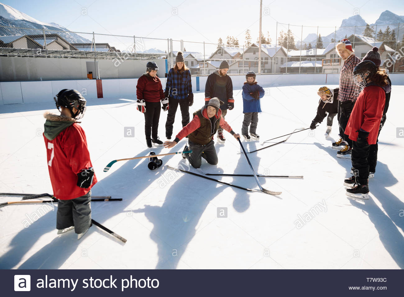 Community playing outdoor ice hockey Stock Photo Alamy