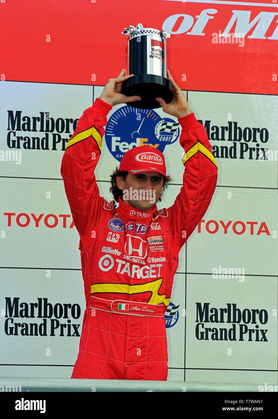 Cart driver Alex Zanardi stands on the podium at the 1998 Grand Prix of Miami at Homestead-Miami Speedway. Stock Photo