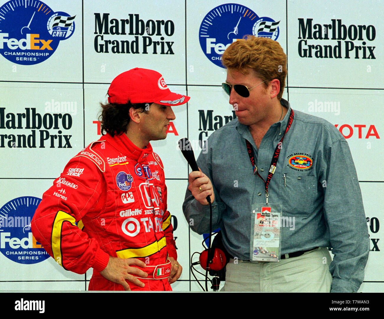 Cart driver Alex Zanardi being interviewed by Ed Berliner on the podium at the 1998 Grand Prix of Miami at Homestead-Miami Speedway. Stock Photo