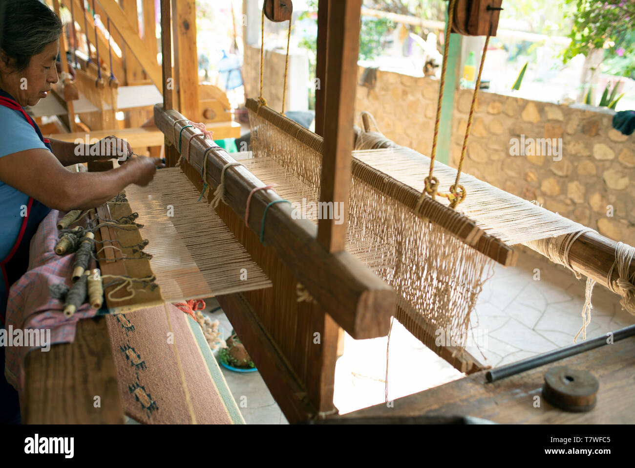 Zapotec woman weaving a rug on a pedal loom. Teotitlan del Valle, Oaxaca,  Mexico. Apr 2019 Stock Photo - Alamy