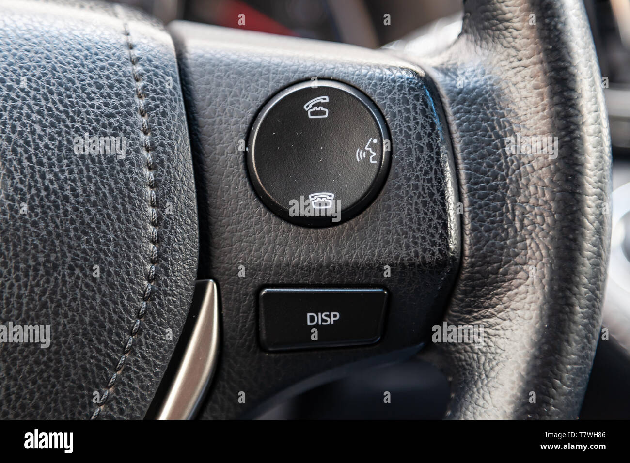 Phone control buttons via bluetooth on the steering wheel of a car  close-up, the system "hands-free" gadget for driver safety, equipment for  switching Stock Photo - Alamy