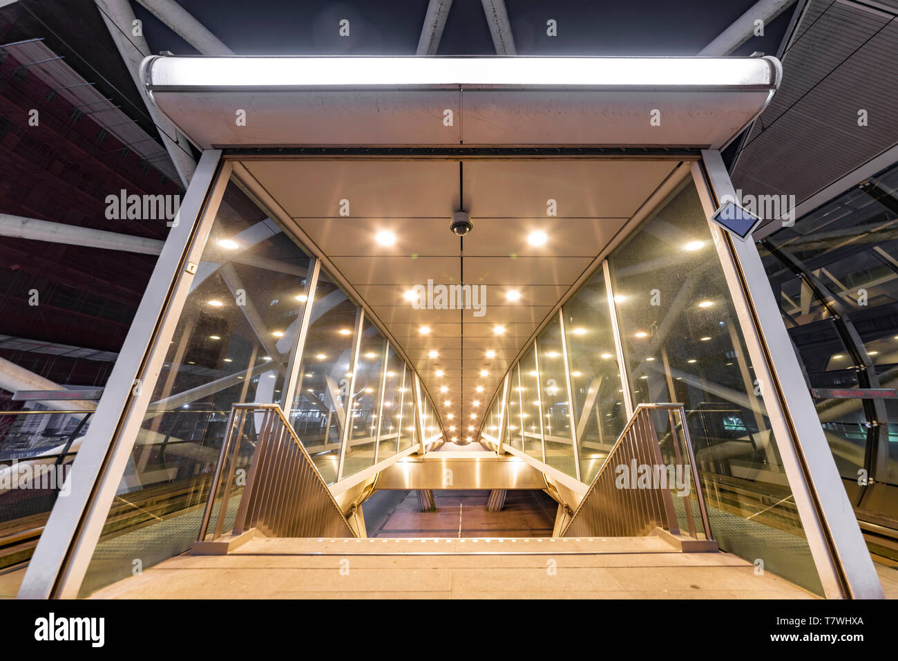 Beatrixkwartier (Beatrix district in Dutch) entrance East escalator getting out from tramway station in The Hague at night, Netherlands Stock Photo
