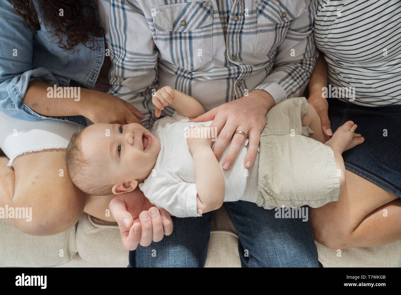 family of  4 in north Philadelphia, 6 month old baby, 15 year old sister. Stock Photo