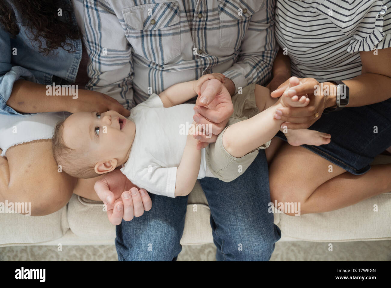 family of  4 in north Philadelphia, 6 month old baby, 15 year old sister. Stock Photo