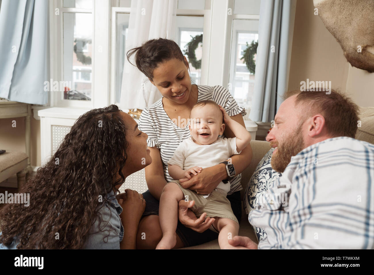 family of  4 in north Philadelphia, 6 month old bby, 15 year old sister. Stock Photo