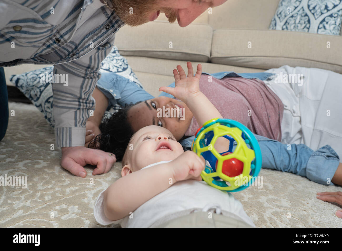 family of  4 in north Philadelphia, 6 month old bby, 15 year old sister. Stock Photo