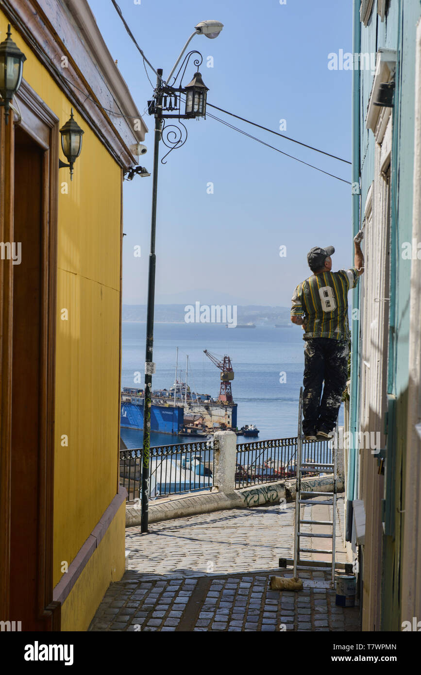House painter in the street of Valparaiso, Chile Stock Photo