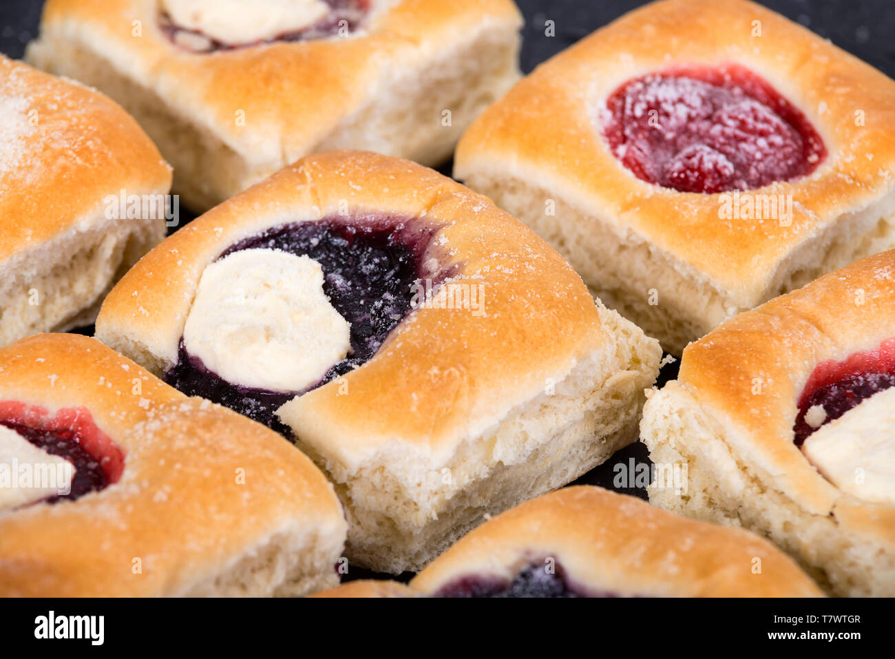 Assortment of sweet Kolache, Czech pastry cakes, with fruit, berry and cream cheese fillings. Stock Photo