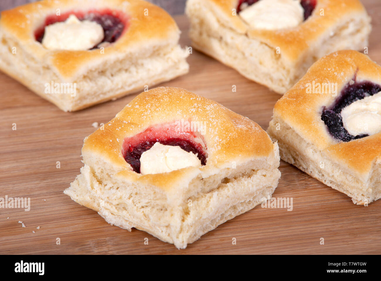 Assortment of sweet Kolache, Czech pastry cakes, with fruit, berry and cream cheese fillings. Stock Photo