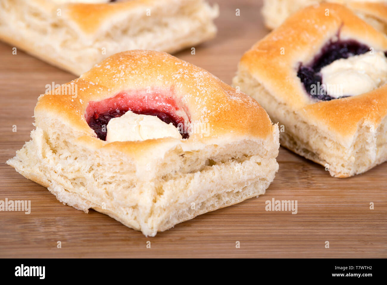 Assortment of sweet Kolache, Czech pastry cakes, with fruit, berry and cream cheese fillings. Closeup. Stock Photo