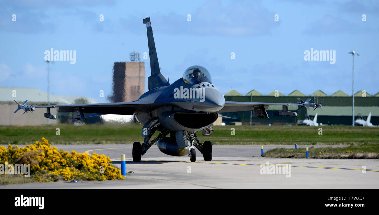 An F-16 Fighting Falcon from the 480th Fighter Squadron, 52nd Fighter Wing, Spangdahlem Air Base, Germany, taxis after a low-level training sortie at RAF Lossiemouth, Scotland, May 7, 2019, during exercise Formidable Shield. Formidable Shield is a U.S.-led exercise, conducted by Naval Striking and Support Forces NATO. The purpose of the training is to improve allied interoperability in a live-fire integrated air and missile defense exercise. (U.S. Air Force photo by Master Sgt. Austin M. May) Stock Photo