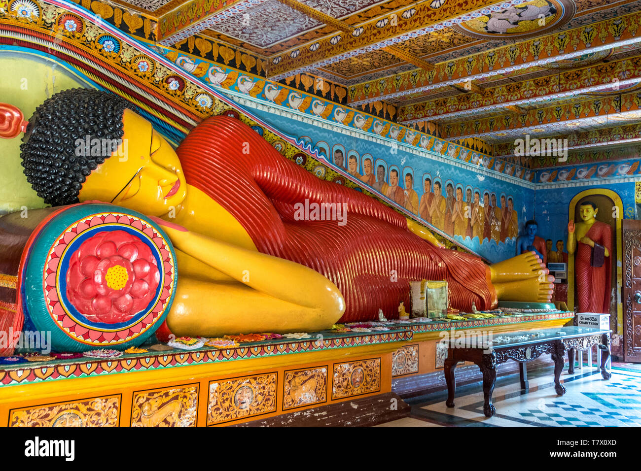 Reclining statue of Buddha in the rock temple of the Isurumuniya Monastery, Anuradhapura, Sri Lanka Stock Photo