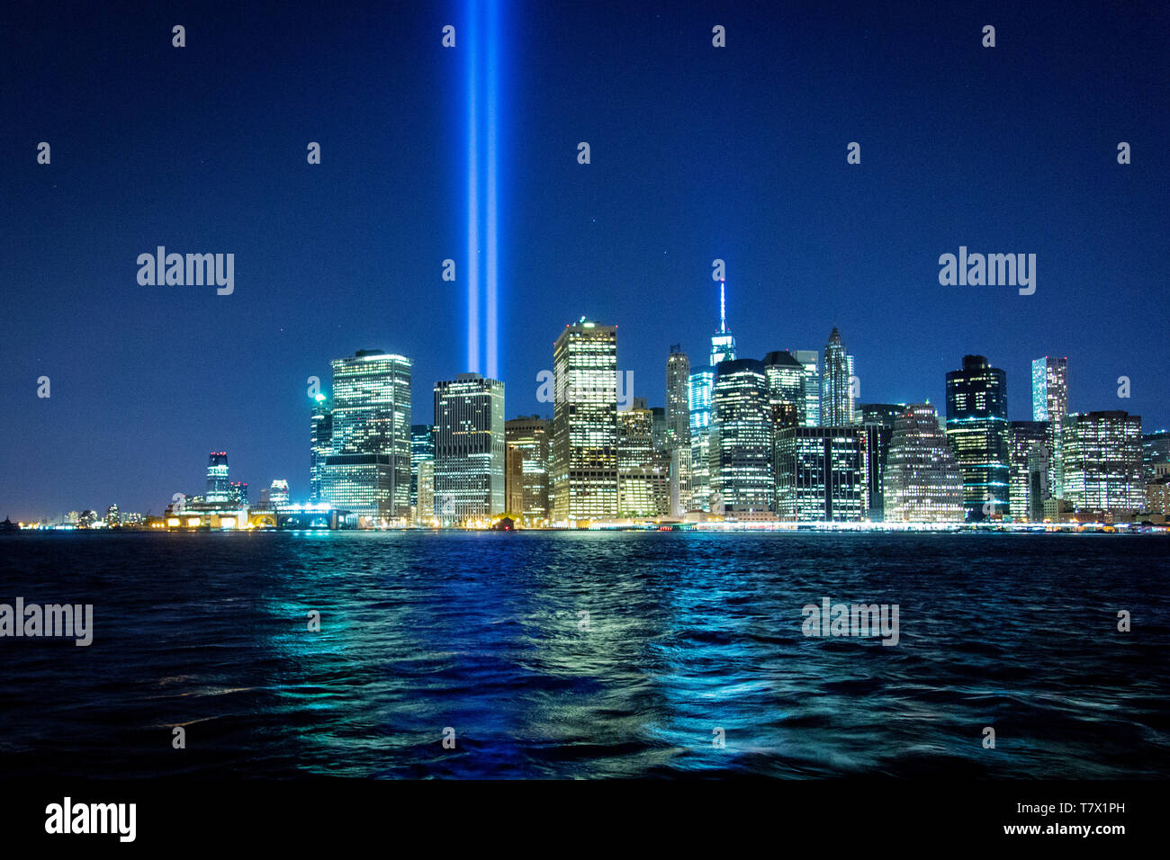 The Towers of Light beam towards the sky on the 13th anniversary of the September 11 attack that brought down the World Trade Center and killed 2996 people. Stock Photo
