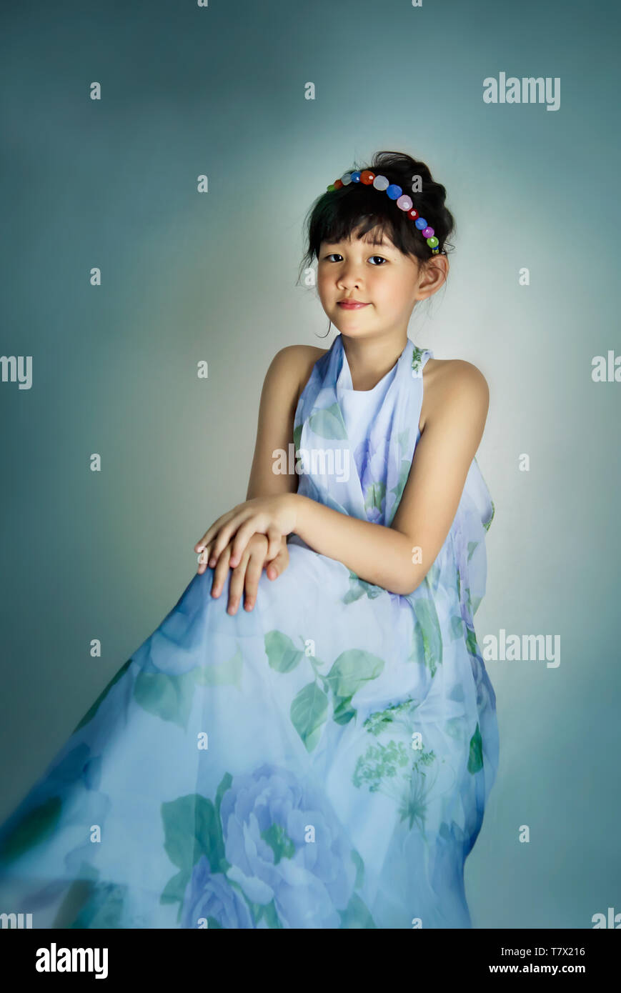 portrait of asian little girl in blue dress Stock Photo - Alamy