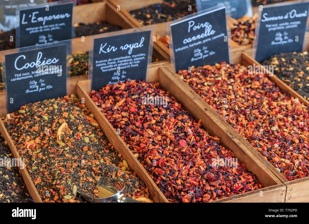 Exotic flavored teas with pear, cinnamon, kir royal, cookie and other flavors for sale at a local outdoor farmers market in Nice, France Stock Photo