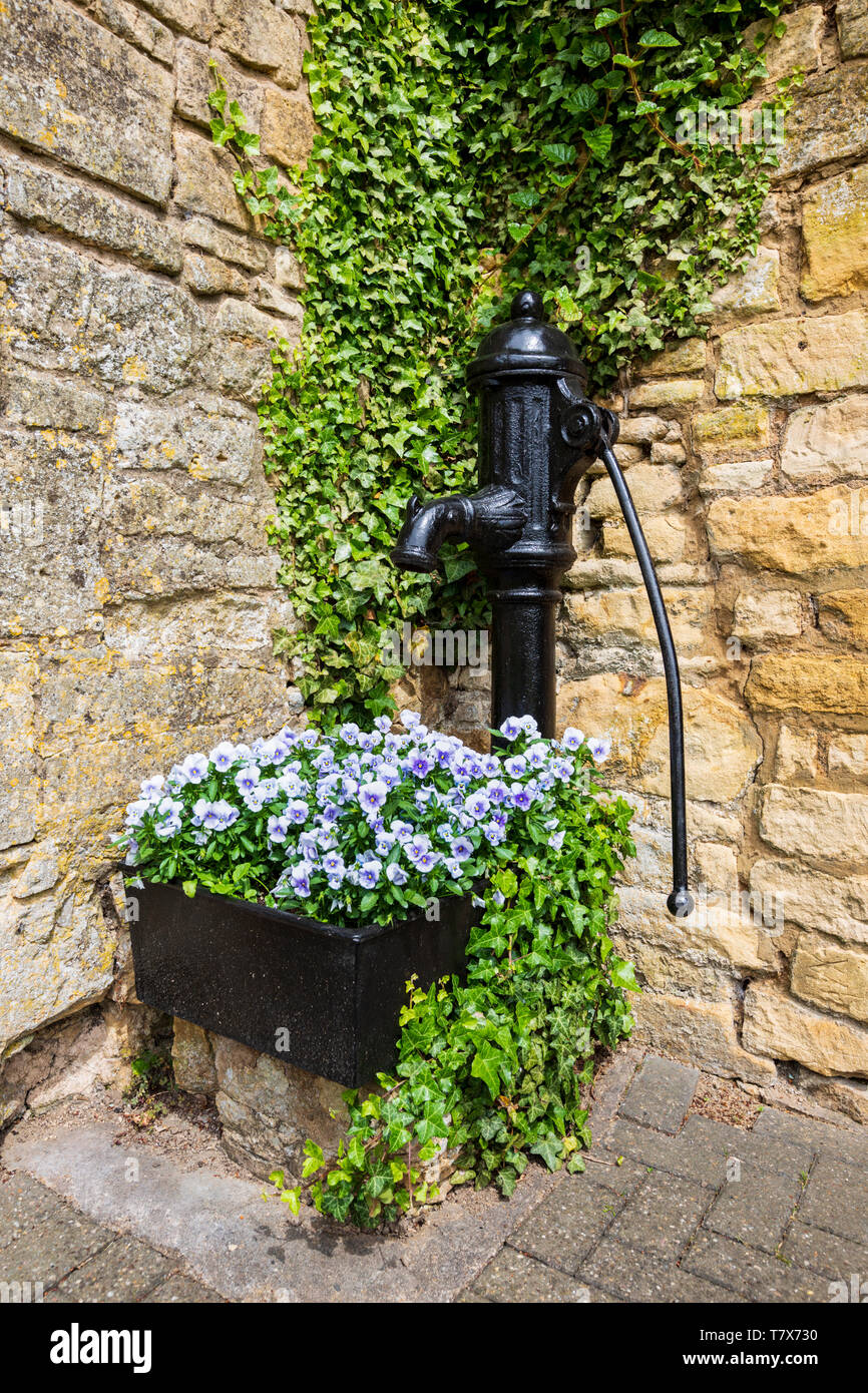 An old disused water pump at the end of the High Street in Chipping Campden, England Stock Photo
