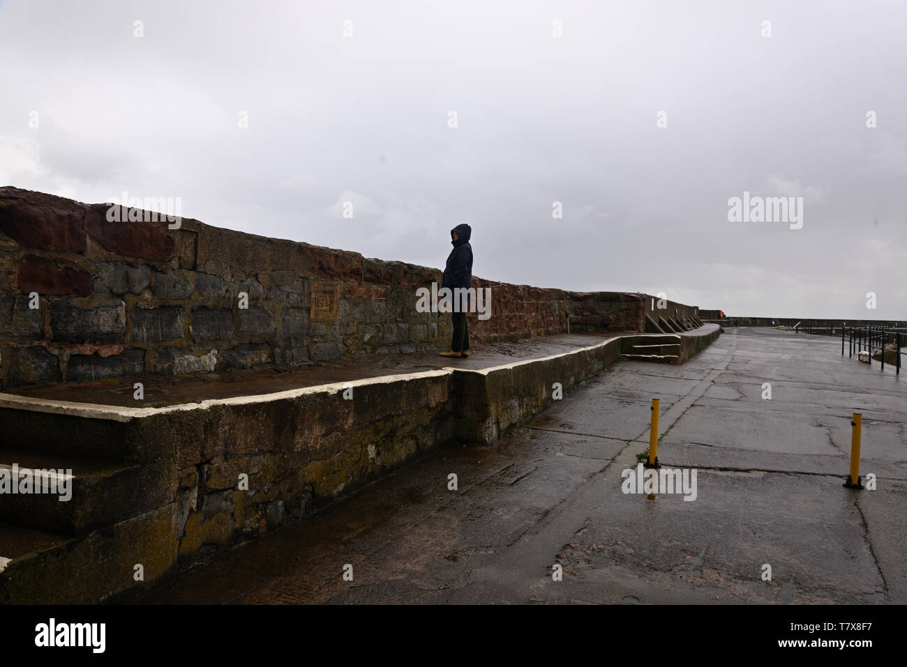 A very wet day at Watchet harbour walk. Stock Photo