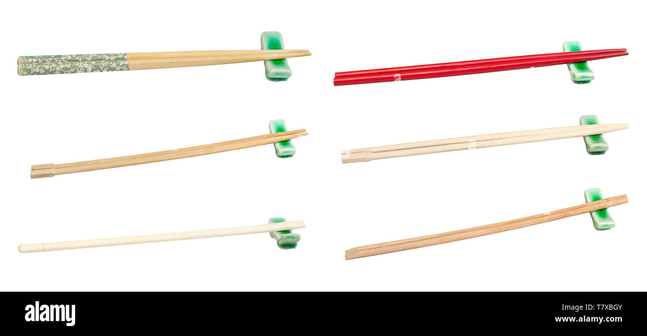 set of various wooden chopsticks served on chopstick rest isolated on