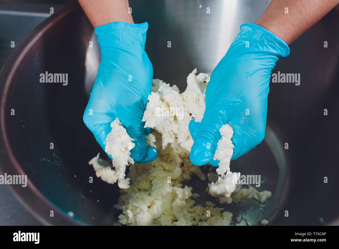 Traditional Cheese Making In A Small Company. Cheese Maker Hands Close