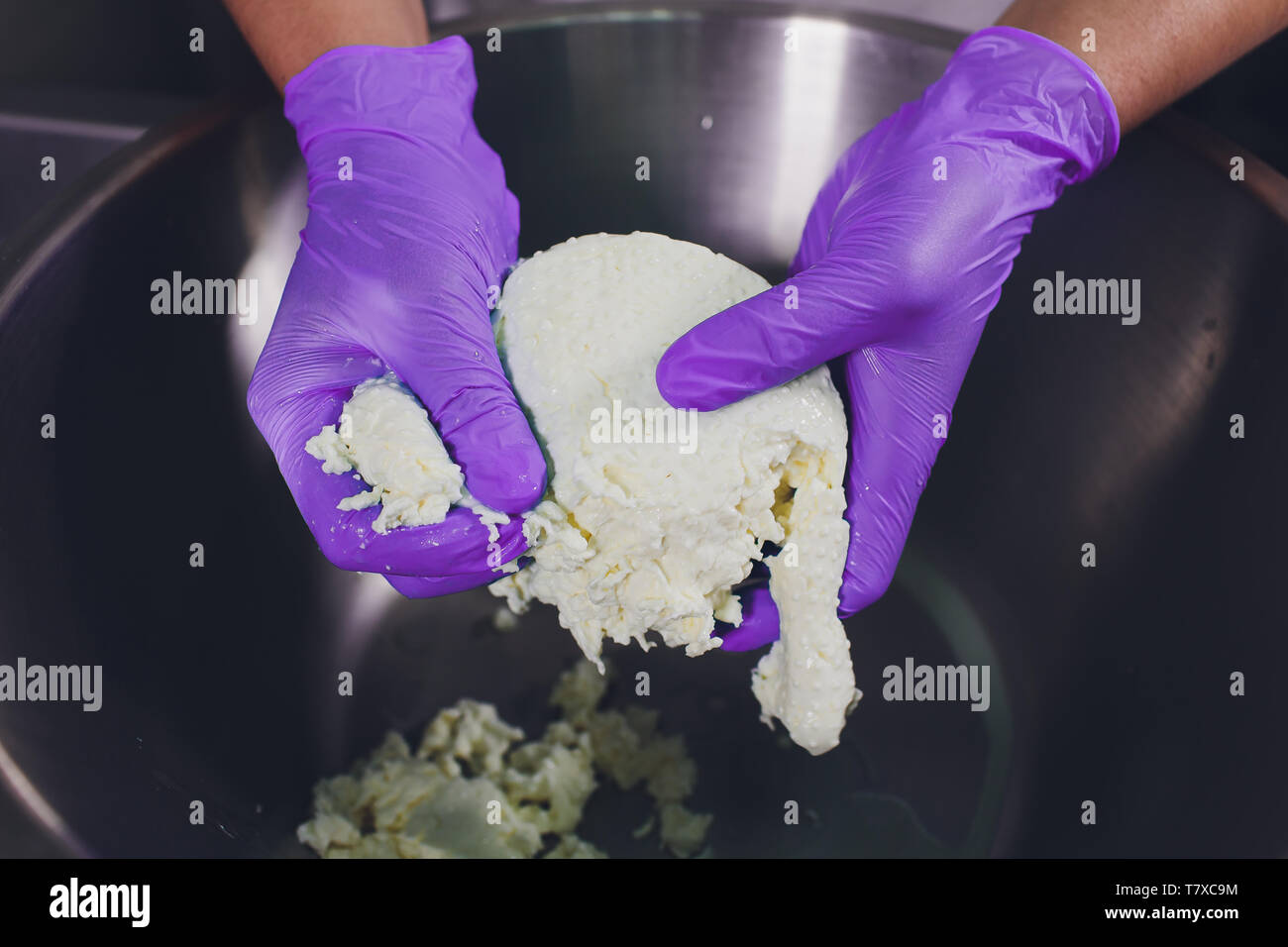 Traditional Cheese Making In A Small Company. Cheese Maker Hands Close
