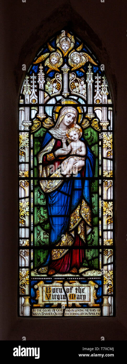 Stained glass window Blessed Virgin Mary baby infant Jesus Christ, church of Saint Andrew, Ilketshall St Andrew, Suffolk, England, UK Stock Photo