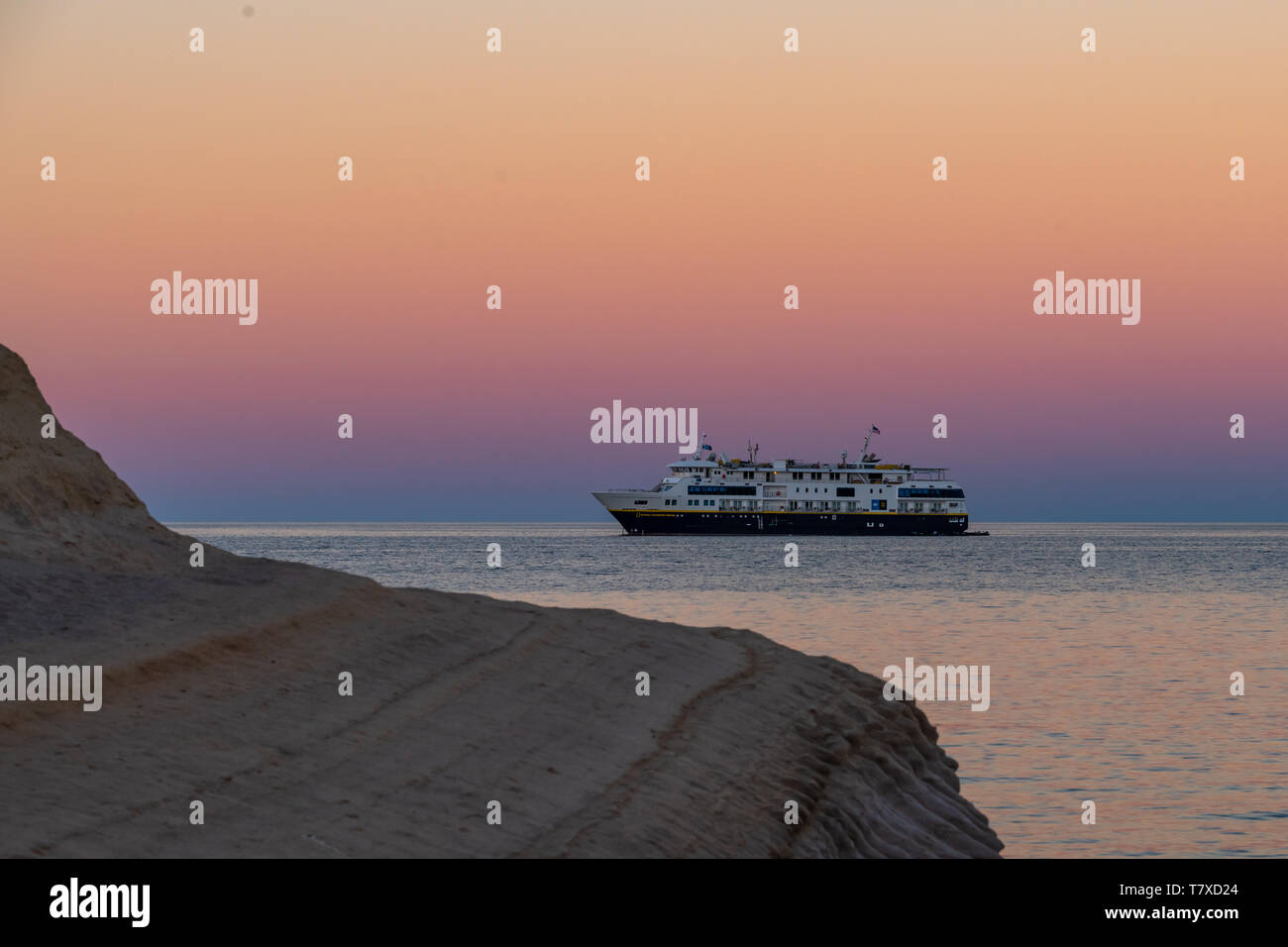 The Lindblad National Geographic Venture anchored at sunset off the shore of Isla San Jose, Baja California Sur, Mexico. Stock Photo