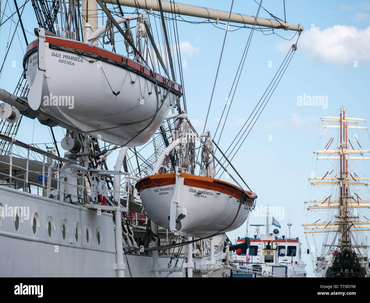 Life boats on Dar Pomorza and (in background) Dar Młodzieży tall ships, Gdynia, Poland Stock Photo
