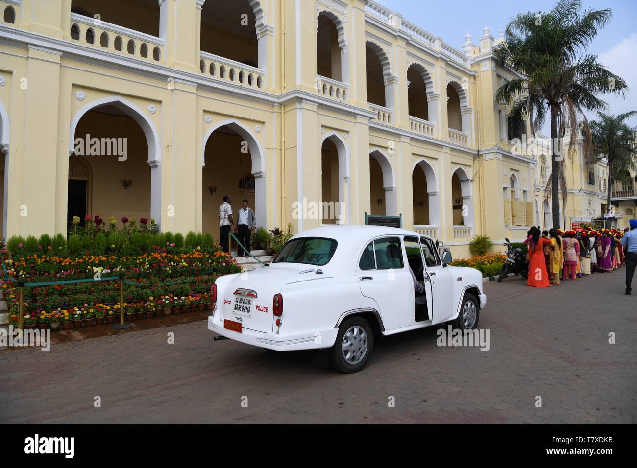 Hindustan Ambassador car parked outside Mysore Palace, India Stock Photo