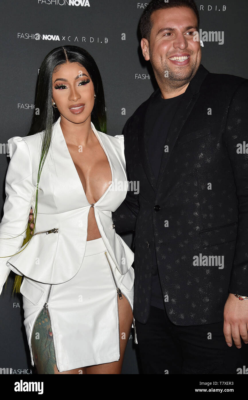 LOS ANGELES, CA - MAY 08: Cardi B (L) and CEO of FashionNova Richard Saghian attend the Fashion Nova x Cardi B Collection Launch Party at Hollywood Palladium on May 08, 2019 in Los Angeles, California. Stock Photo