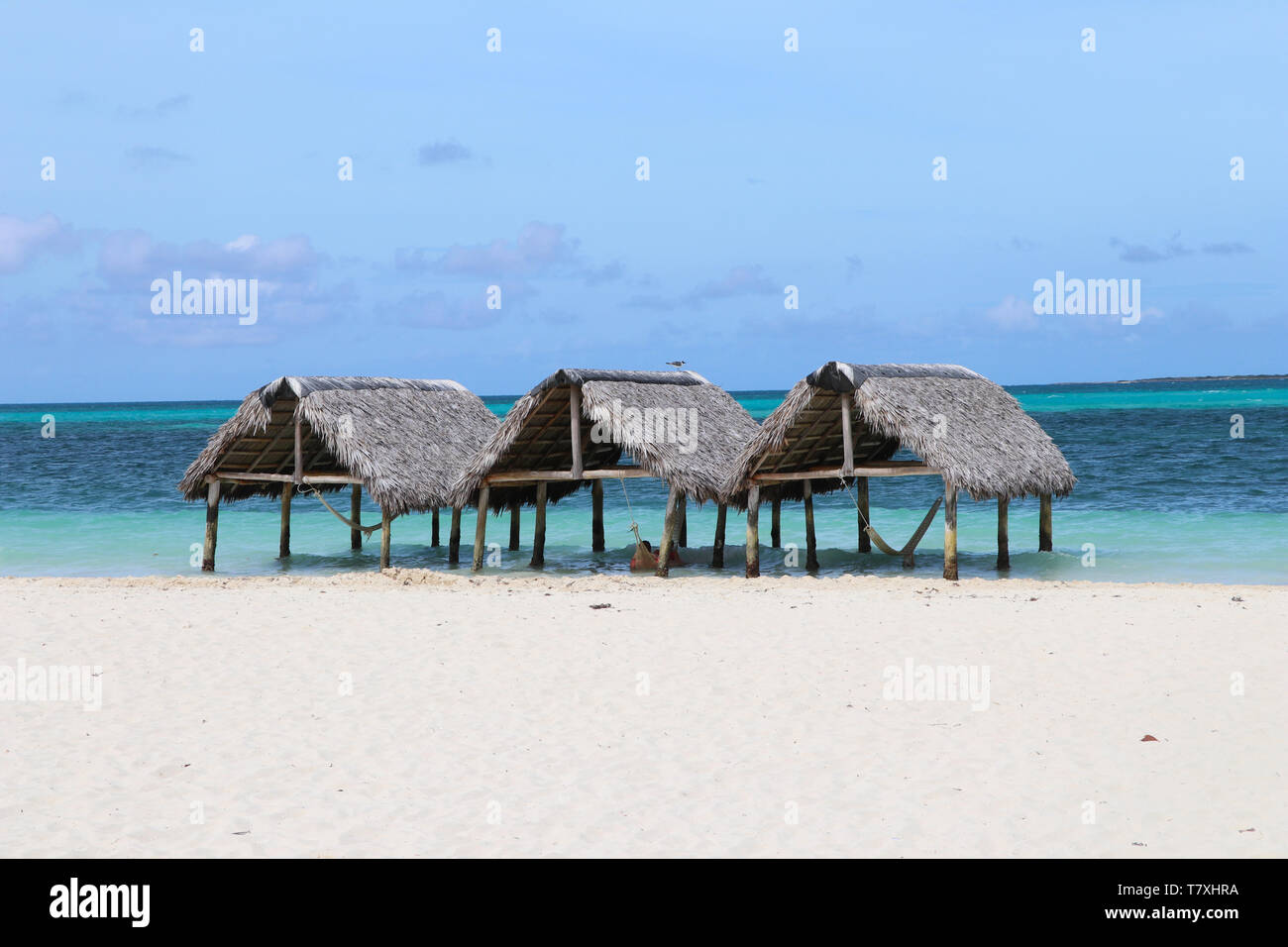 Thatched roof huts on paradise beach Stock Photo
