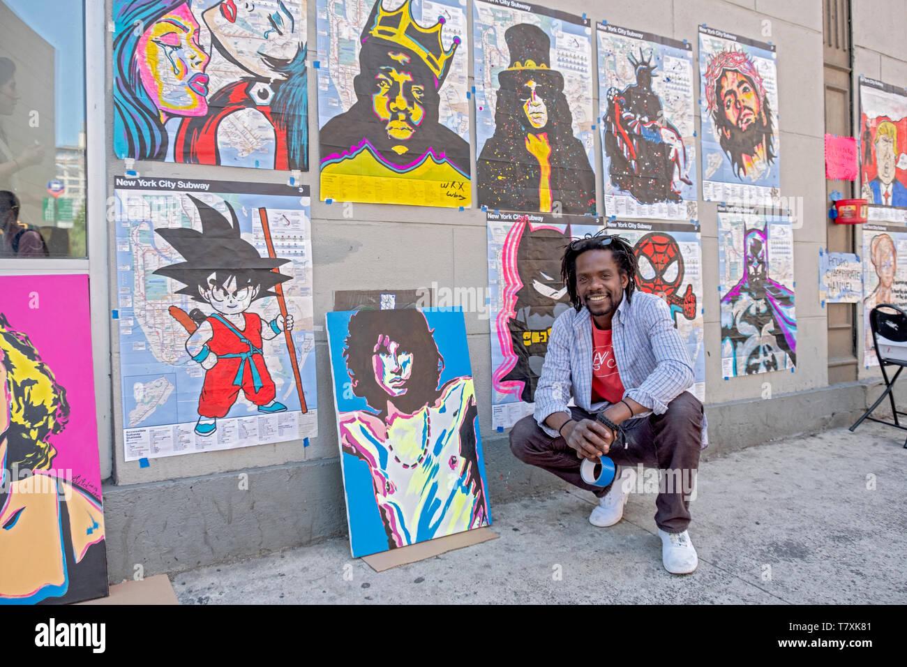 POSed portrait of a street artist who paints on subway maps. In Greenwich Village, Manhattan, New York City. Stock Photo