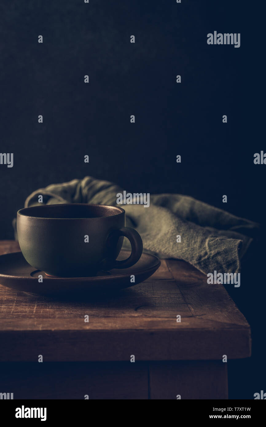 Empty green coffee cup on wooden table Stock Photo