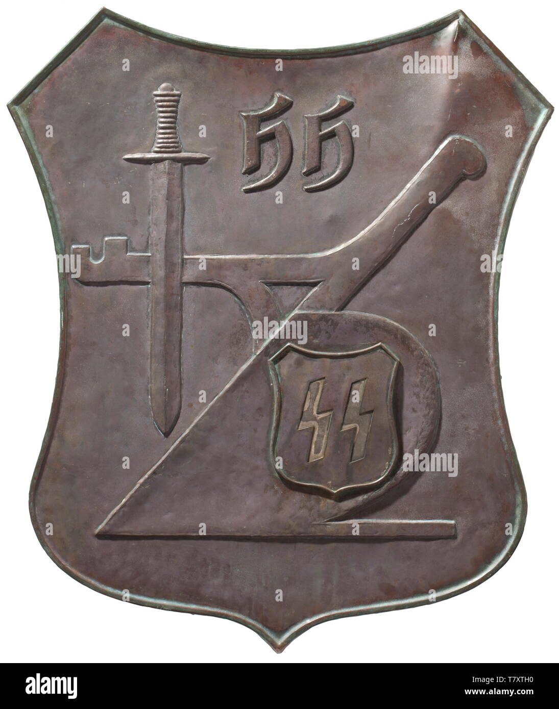 Heinrich Himmler - a farmstead shield 'Wehrbauer', Large sheet bronze escutcheon with depictions in relief of a ploughshare, a sword, SS runes and Himmler's initials 'HH', the reverse with braces and vestiges of cement. 87 x 96 cm. 'Wehrbauer' originally referred to farmers who lived in border areas so as to be able to defend them if needed. Himmler sought to revitalise this concept to unite it with his 'blood and soil' ideology and thus to literally build a 'human wall' around the borders of the German Reich. As a priority meritorious SS soldiers would be granted estates i, Editorial-Use-Only Stock Photo