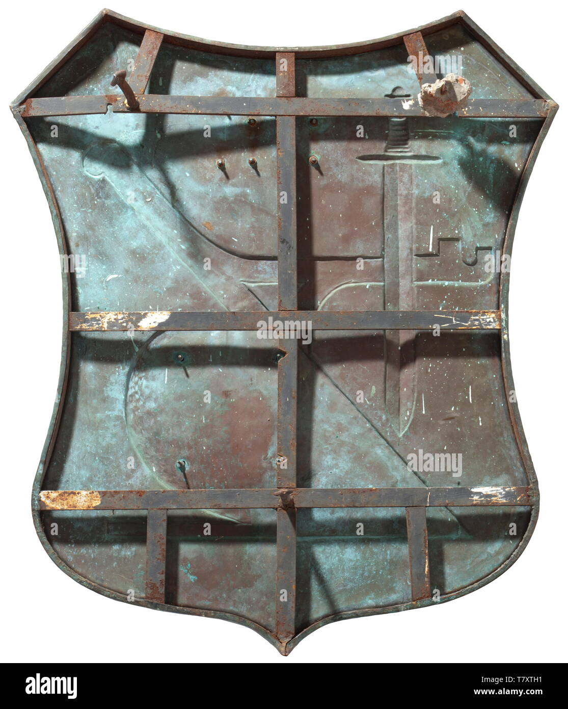 Heinrich Himmler - a farmstead shield 'Wehrbauer', Large sheet bronze escutcheon with depictions in relief of a ploughshare, a sword, SS runes and Himmler's initials 'HH', the reverse with braces and vestiges of cement. 87 x 96 cm. 'Wehrbauer' originally referred to farmers who lived in border areas so as to be able to defend them if needed. Himmler sought to revitalise this concept to unite it with his 'blood and soil' ideology and thus to literally build a 'human wall' around the borders of the German Reich. As a priority meritorious SS soldiers would be granted estates i, Editorial-Use-Only Stock Photo