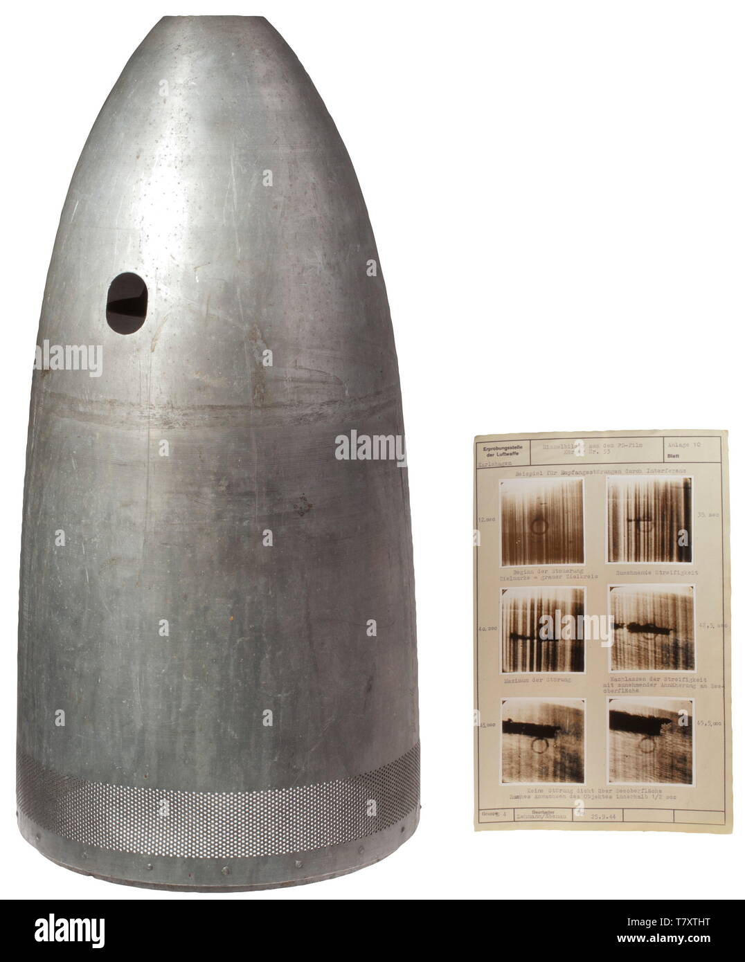 Henschel HS 293 - an outer casing and a test report of an engineer of the Luftwaffe testing centre. Outer casing from a trial model of the HS 293 made of aluminium with recesses among others for a telephoto camera and research instruments. Included is a test report from the year 1944 on the 'HS 293 D' with attached telephotos, in which is a detailed report on test trials of the glide bomb with a telephotocamera by means of the sinking of a steamship. The report includes photographs of the 'FB-Gerät' (telephoto device) in the aircraft and the HS 293 D with detached outer cas, Editorial-Use-Only Stock Photo