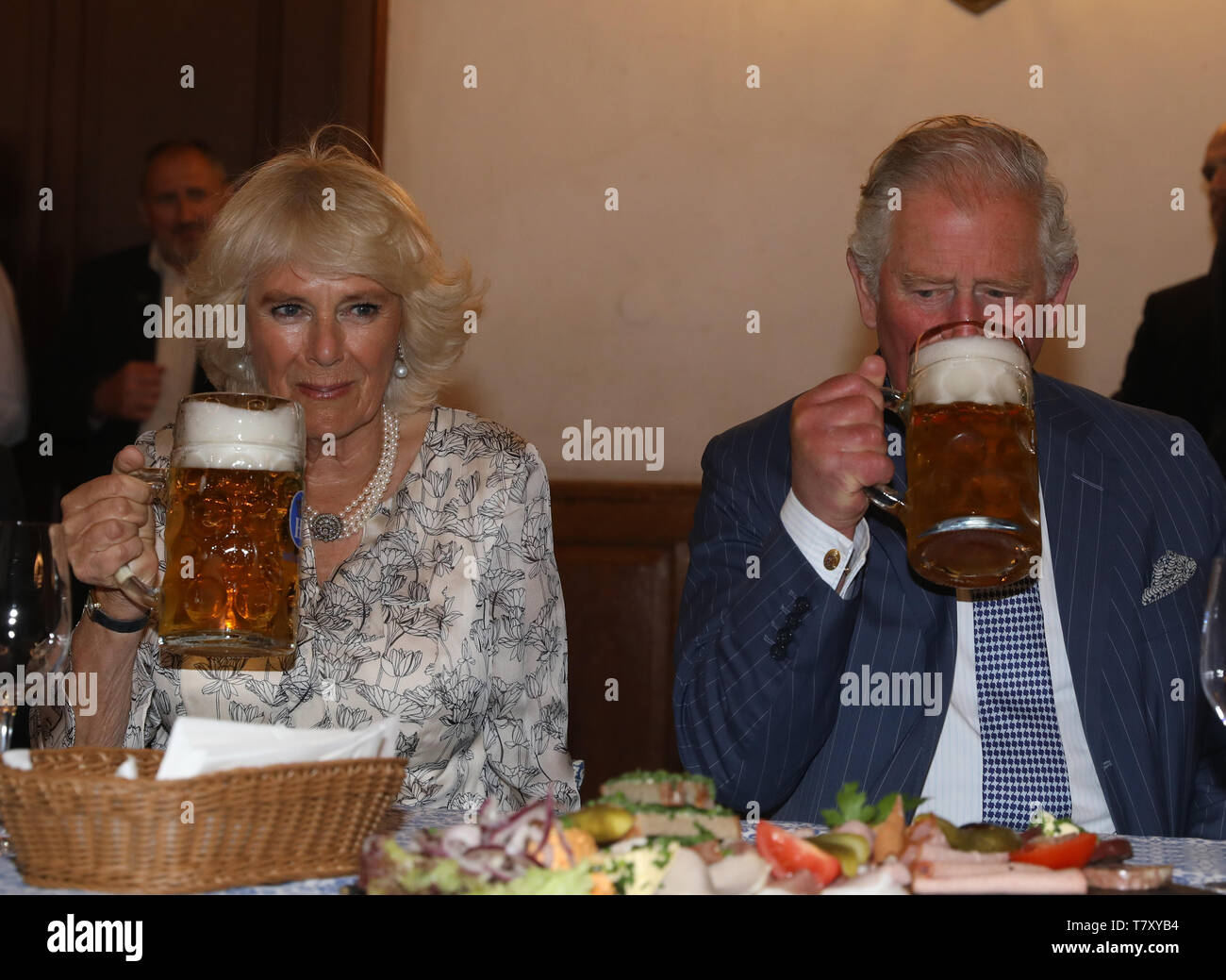 The Prince Of Wales And The Duchess Of Cornwall Hold Beer Steins