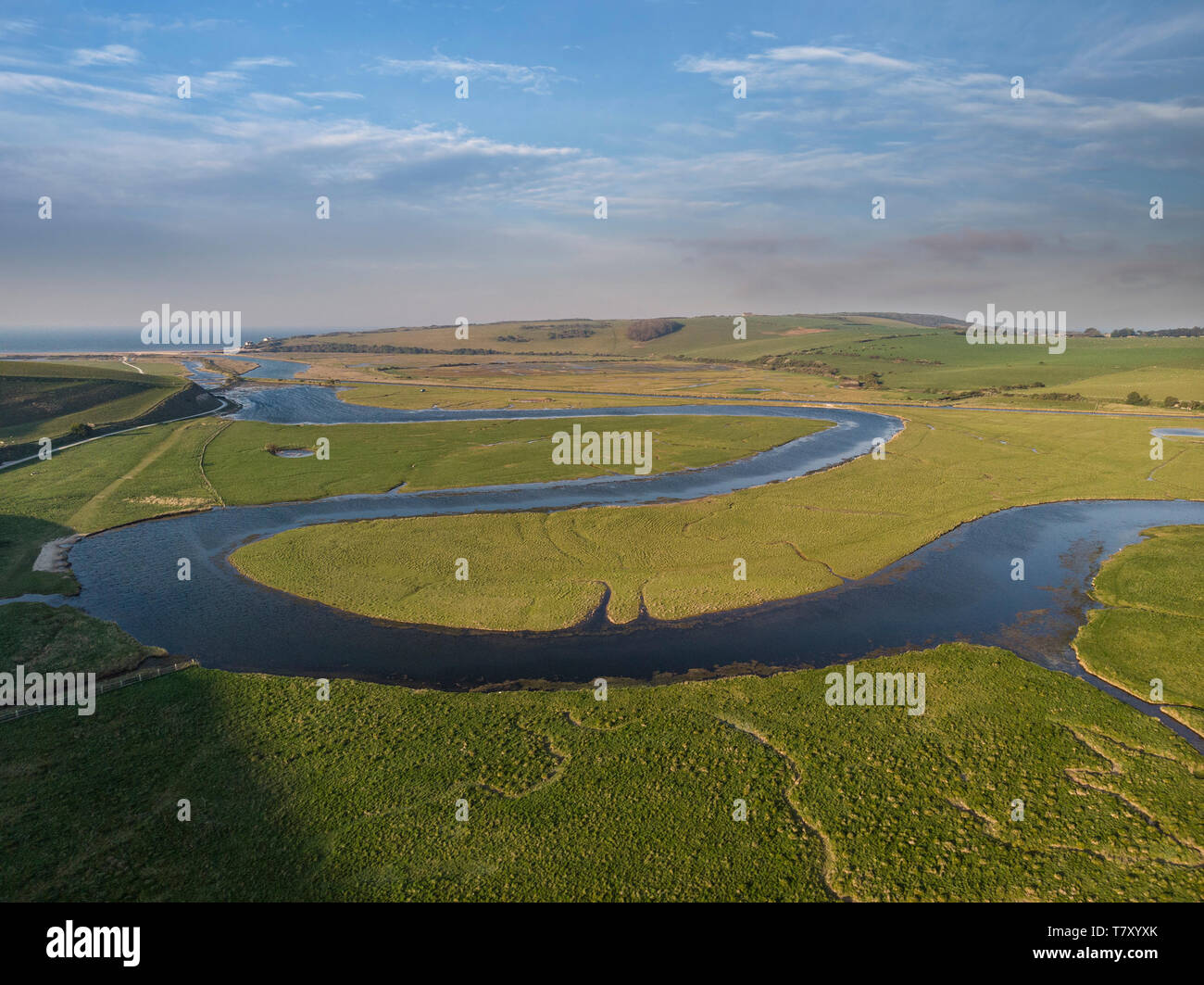 Beautiful aerial drone landscape image of meandering river through marshland at sunrise Stock Photo