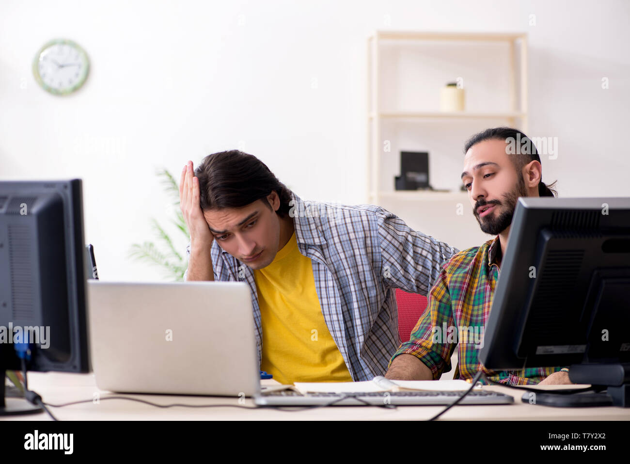 Two it specialists working in the office Stock Photo