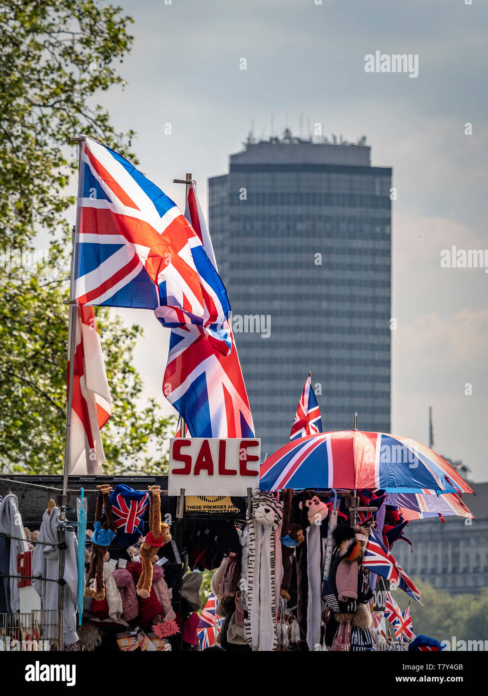 SALE sign with union jack flags and umbrellas on top of souvenir stall