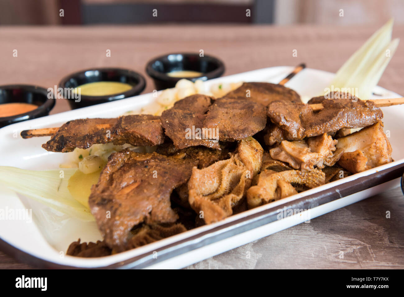 Traditional Peruvian food 'Anticuchos' grilled skewered beef heart meat