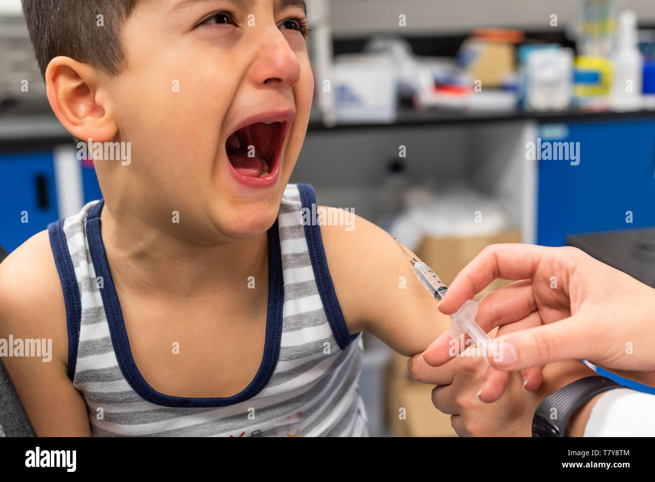 Little Child Crying in Doctors Office stock photo Stock Photo