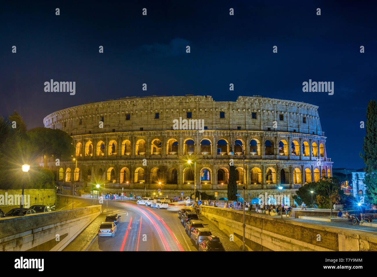 The Grand Colosseum the largest amphitheater built by the Roman Empire at night in Rome - Italy Stock Photo