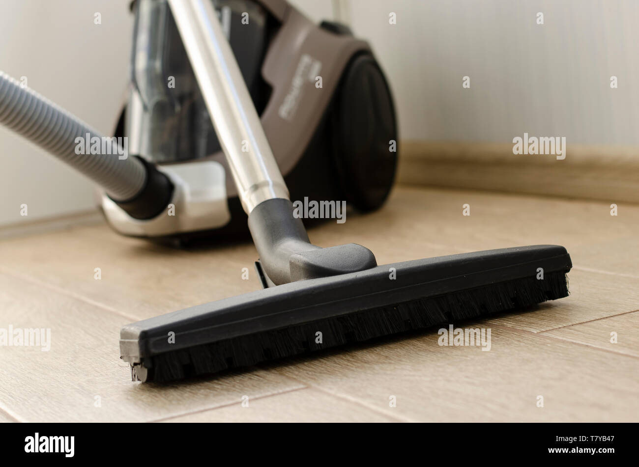 Housekeeping and cleaning concept. Vacuum cleaner nozzle on the floor
