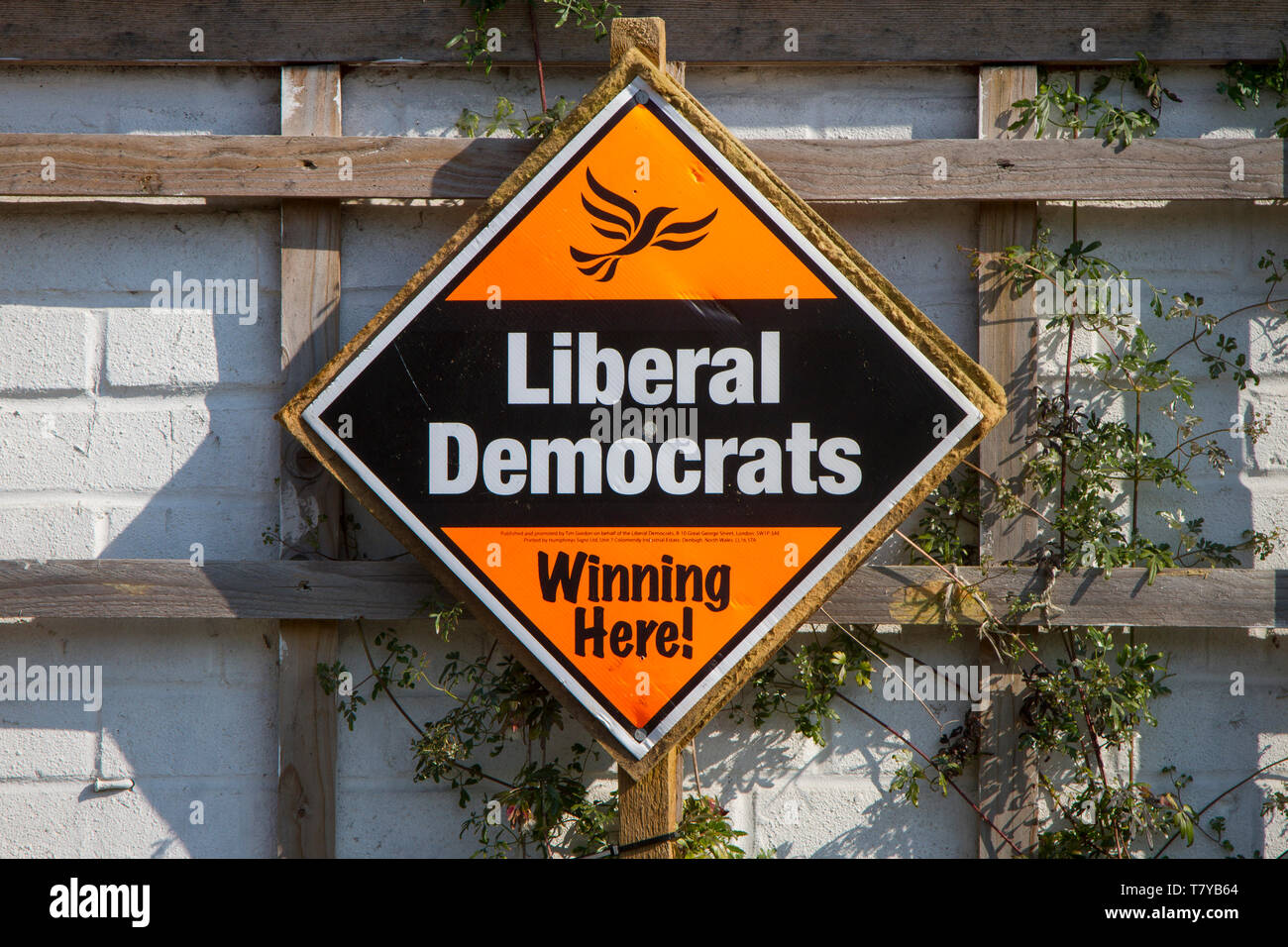 An orange and black election poster for the Liberal Democrats in the local elections reading 'Winning Here'. Stock Photo